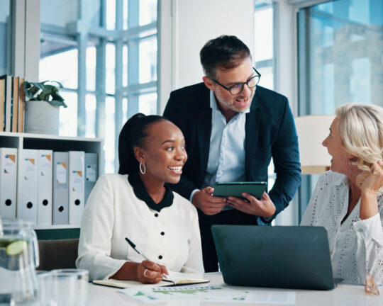 Accounting, office and business people with meeting, feedback and manager for laptop, discussion and graphs. Training, teamwork and talk with tablet, growth strategy or project report for finance
